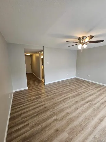 a view of a livingroom with wooden floor