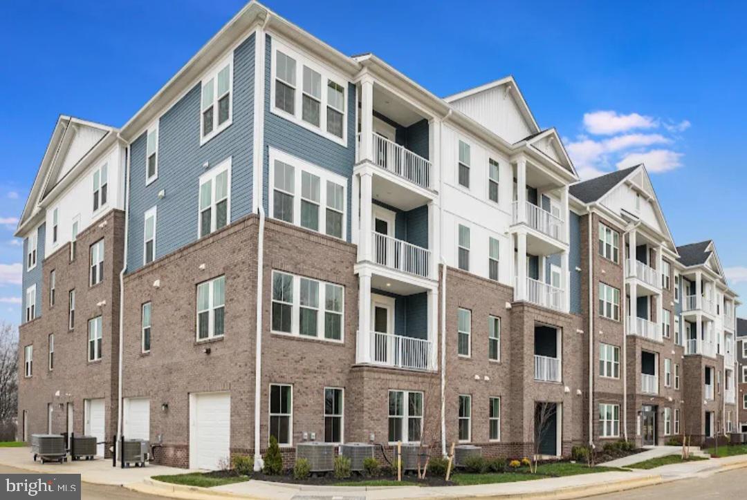 4003 Seaside Alder Road, Unit 305 VIOLET Bowie, MD 20720 - Photo 1 of 18 a front view of a building