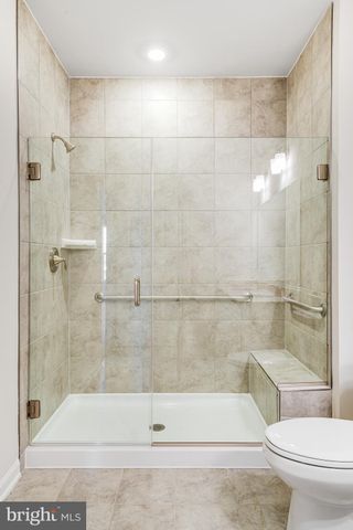 a bathroom with a shower and a toilet
