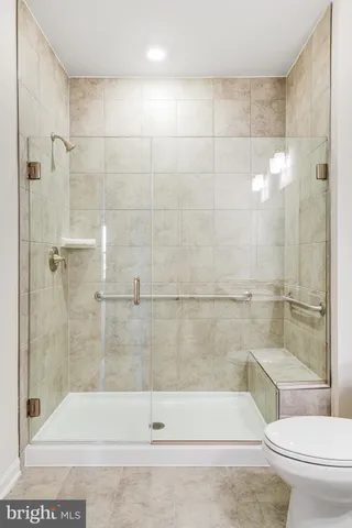 a bathroom with a shower and a toilet