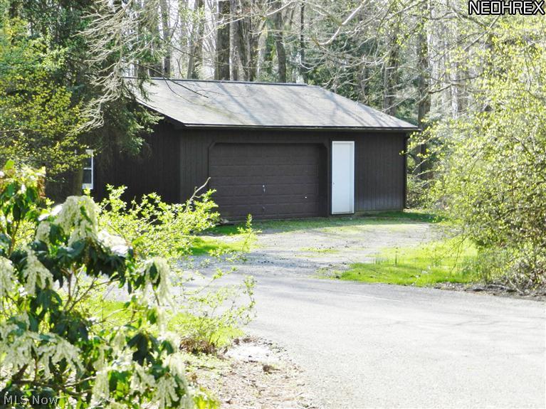 1630 County Line Road Gates Mills, OH 44040 - Photo 21 of 24 Outbuilding, loacated off home's circle drive, provides extra space for outdoor furniture and equipment. Or use it for your car collection-- it will house 2 or more additional vehicles.