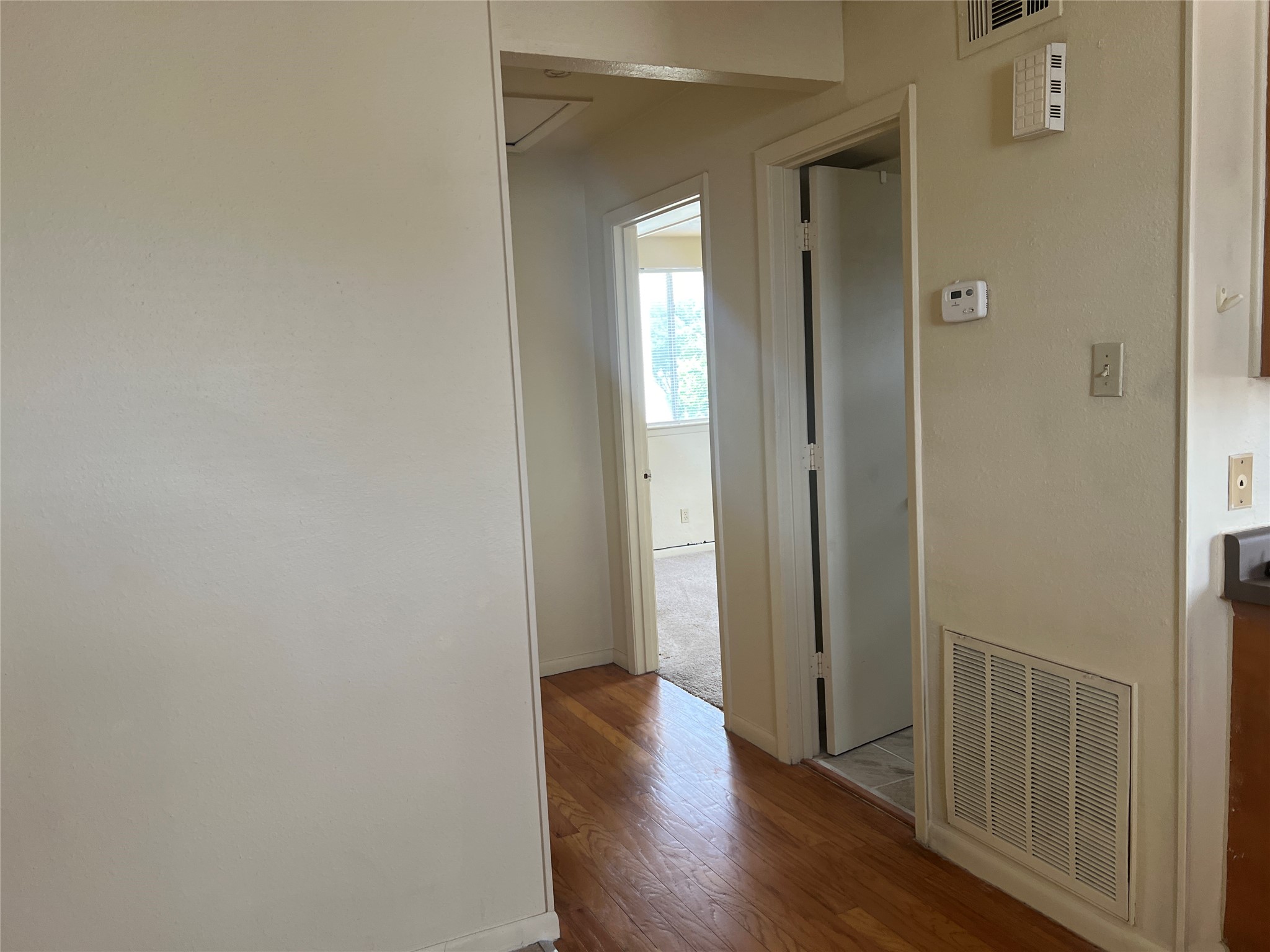 1201 Gillette Street, Unit 4 Houston, TX 77019 - Photo 10 of 12 a view of a hallway with wooden floor