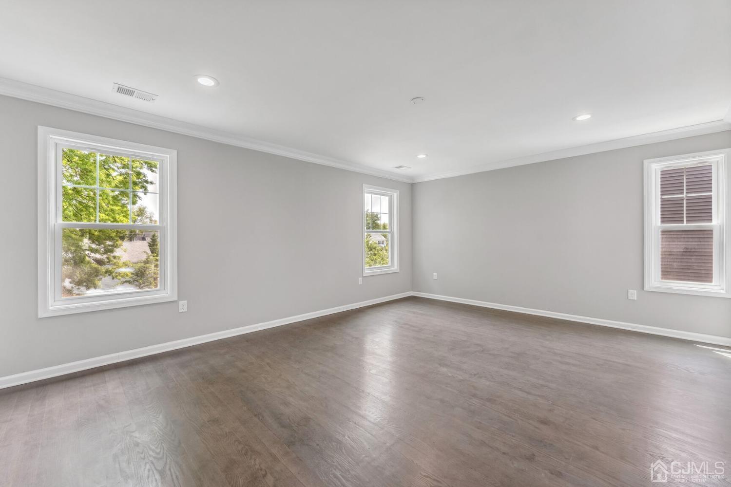 17 Matson Road Edison, NJ 08817 - Photo 11 of 20 an empty room with wooden floor and windows