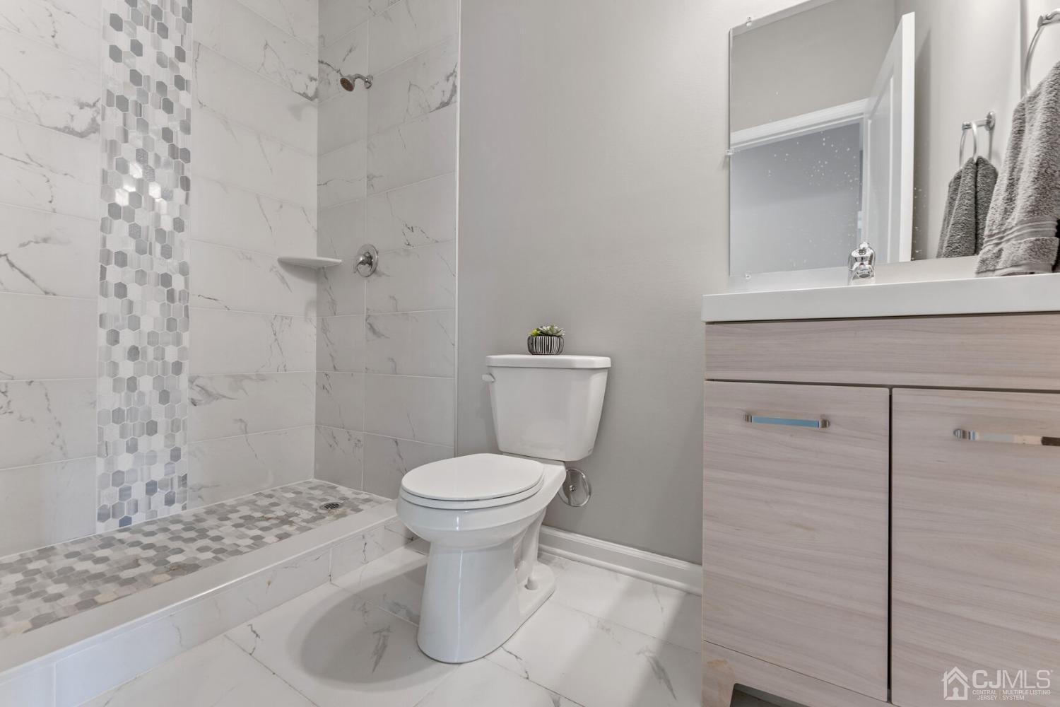 17 Matson Road Edison, NJ 08817 - Photo 15 of 20 a bathroom with a toilet and a shower