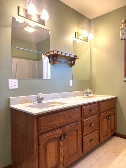 1680 County Road 3200 North Rantoul, IL 61866 - Photo 14 of 23 a bathroom with a granite countertop sink and a mirror