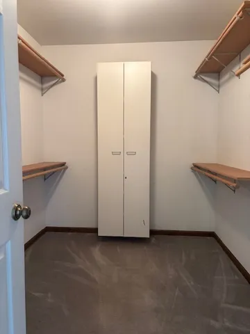 a kitchen with a refrigerator and window