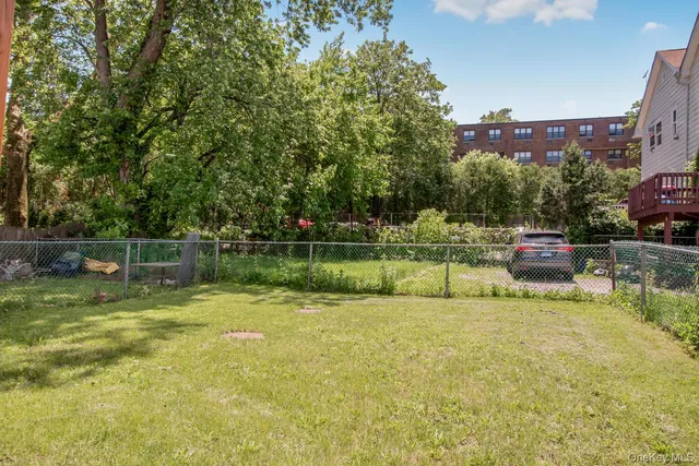 a view of a lake with a house in the background