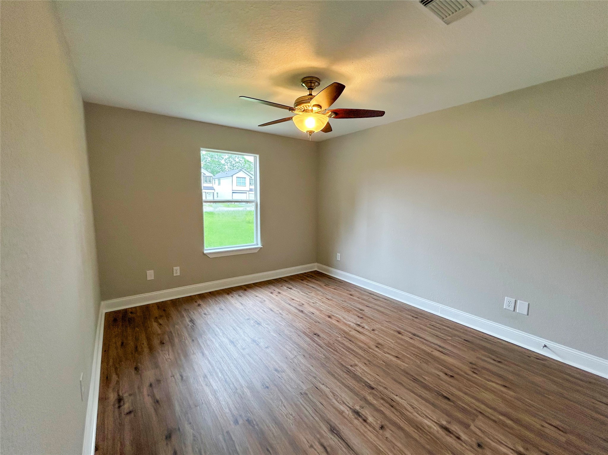 7902 Masters Manvel, TX 77578 - Photo 18 of 21 The secondary bedrooms are spacious and located away from the primary bedroom.