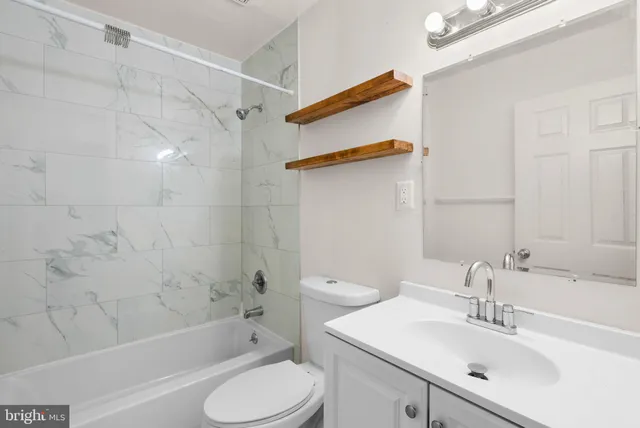 a view of staircase with a rug