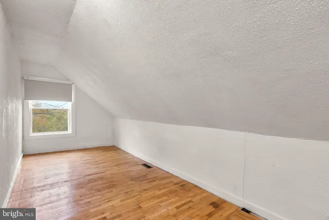 a view of a hallway with stairs