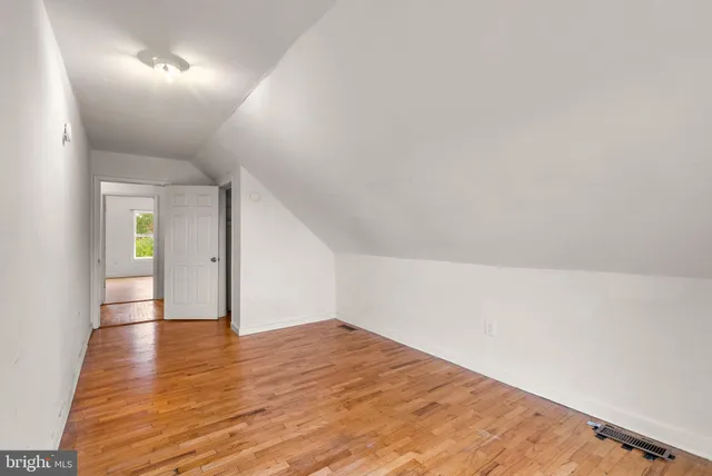 a very nice looking room with stairs and a ceiling fan