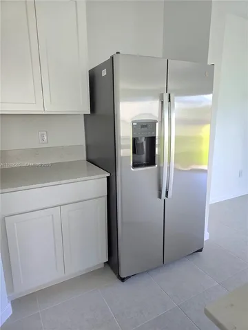 a utility room with cabinets