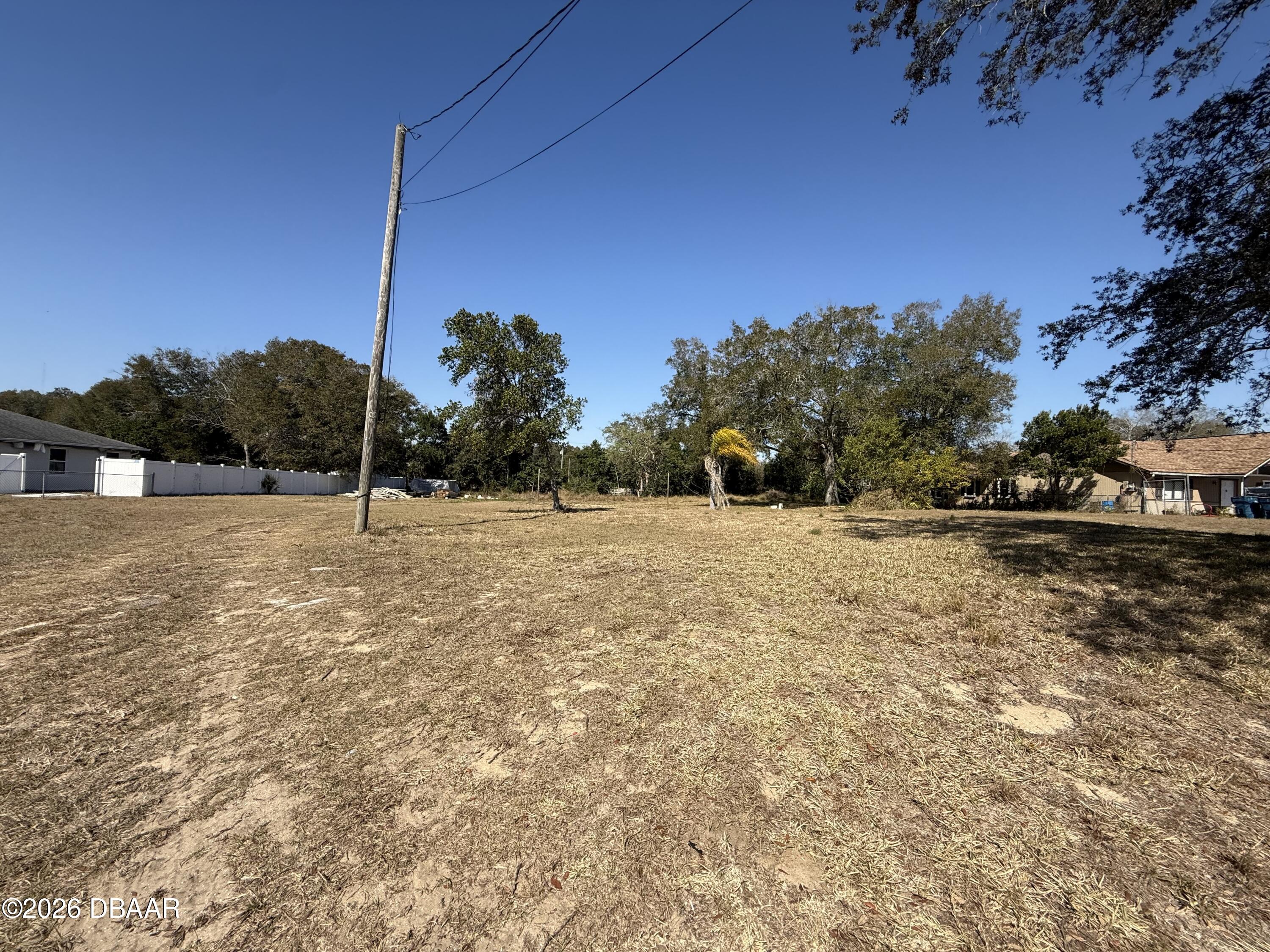 1348 Hurst Street Daytona Beach, FL 32117 - Photo 3 of 5 a backyard of a house with lots of green space