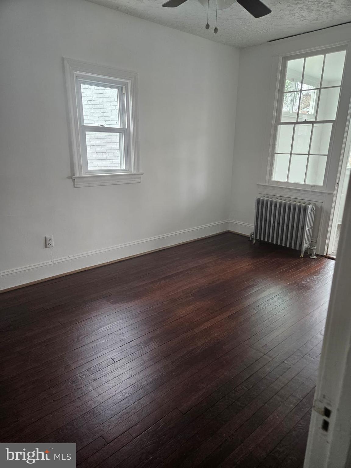 5319 3rd Street Northwest Washington, DC 20011 - Photo 15 of 15 an empty room with wooden floor and windows