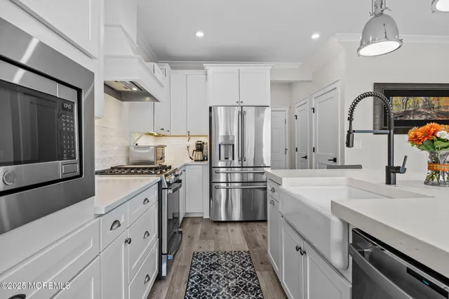 a kitchen with a stove and a sink