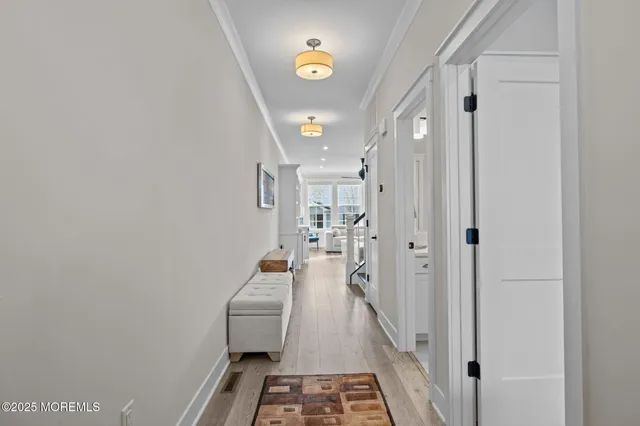 a bathroom with a sink a toilet a mirror and shower