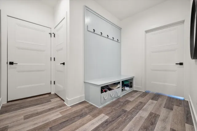 a kitchen with stainless steel appliances granite countertop a refrigerator and wooden cabinets