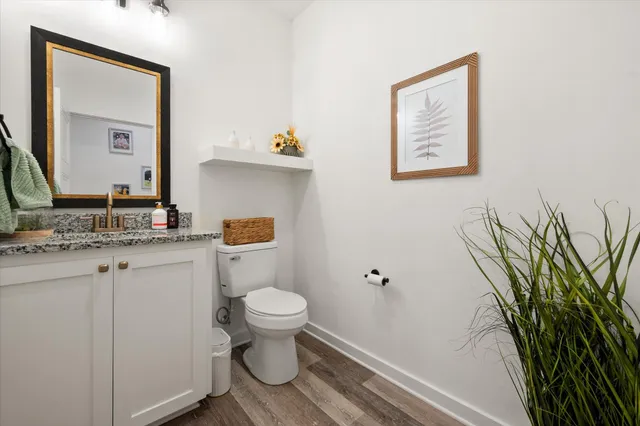 a bedroom with a bed and a ceiling fan