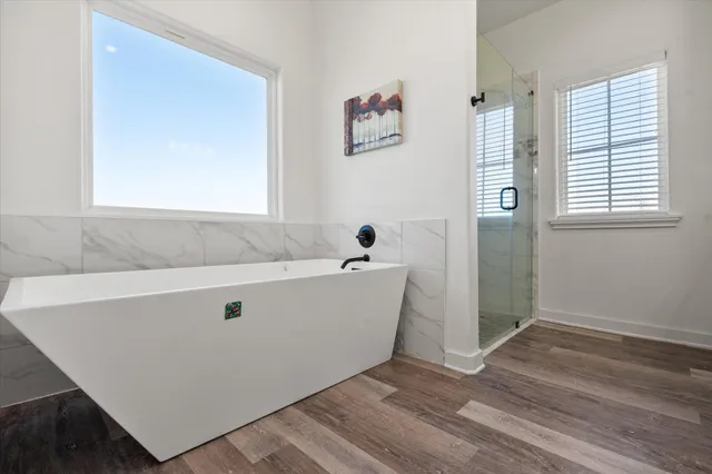 a en suite bathroom with double sink and a mirror