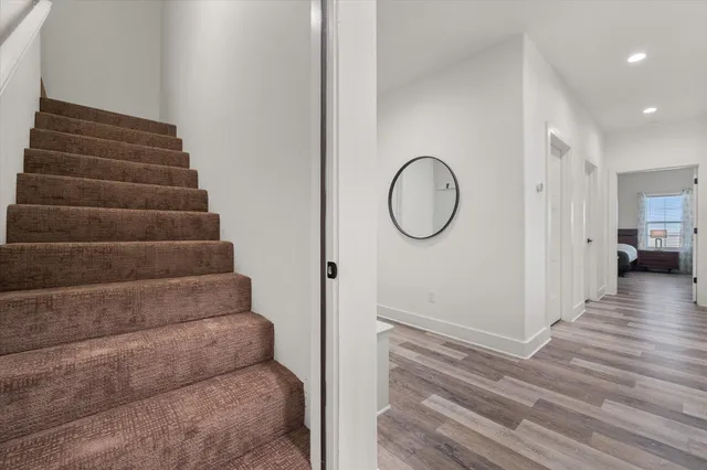 a living room with furniture and a ceiling fan