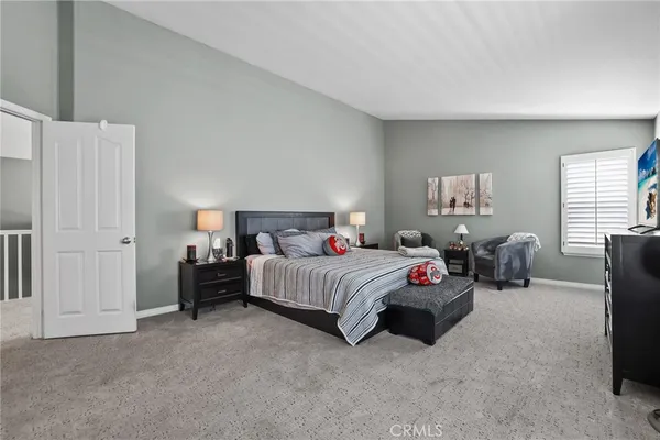 a bedroom with a bed furniture and a window