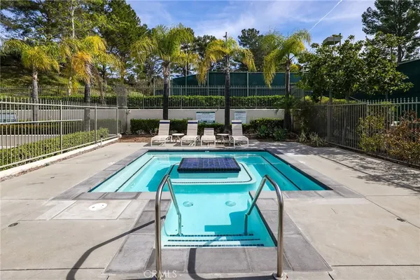 a view of a swimming pool with a patio