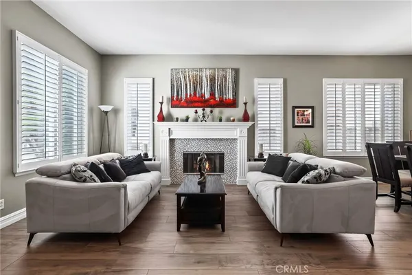 a living room with furniture and a fireplace