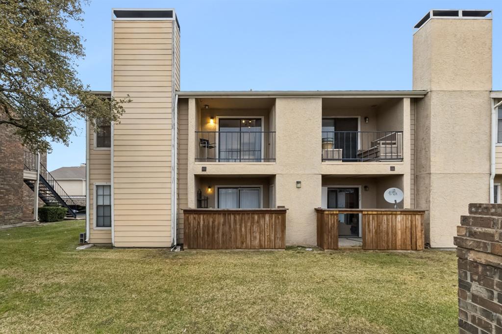 4748 Old Bent Tree Lane, Unit 1808 Dallas, TX 75287 - Photo 21 of 28 a view of a house with a yard and a large window
