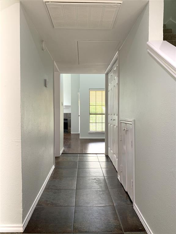 9601 Forest Lane, Unit 1024 Dallas, TX 75243 - Photo 14 of 28 a view of a hallway with wooden floor and a window