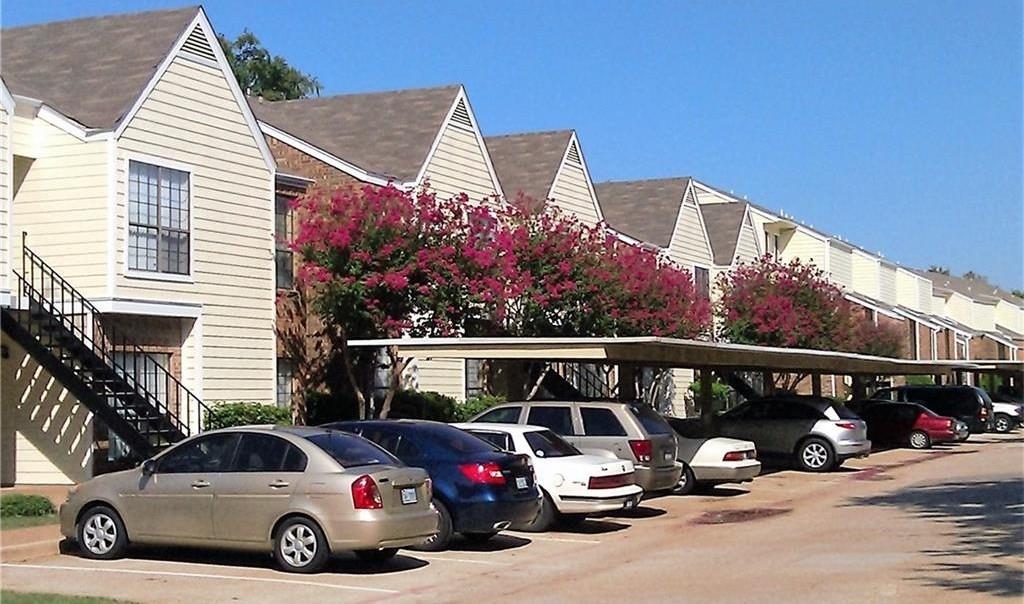 9601 Forest Lane, Unit 1024 Dallas, TX 75243 - Photo 25 of 28 a front view of a house with parking