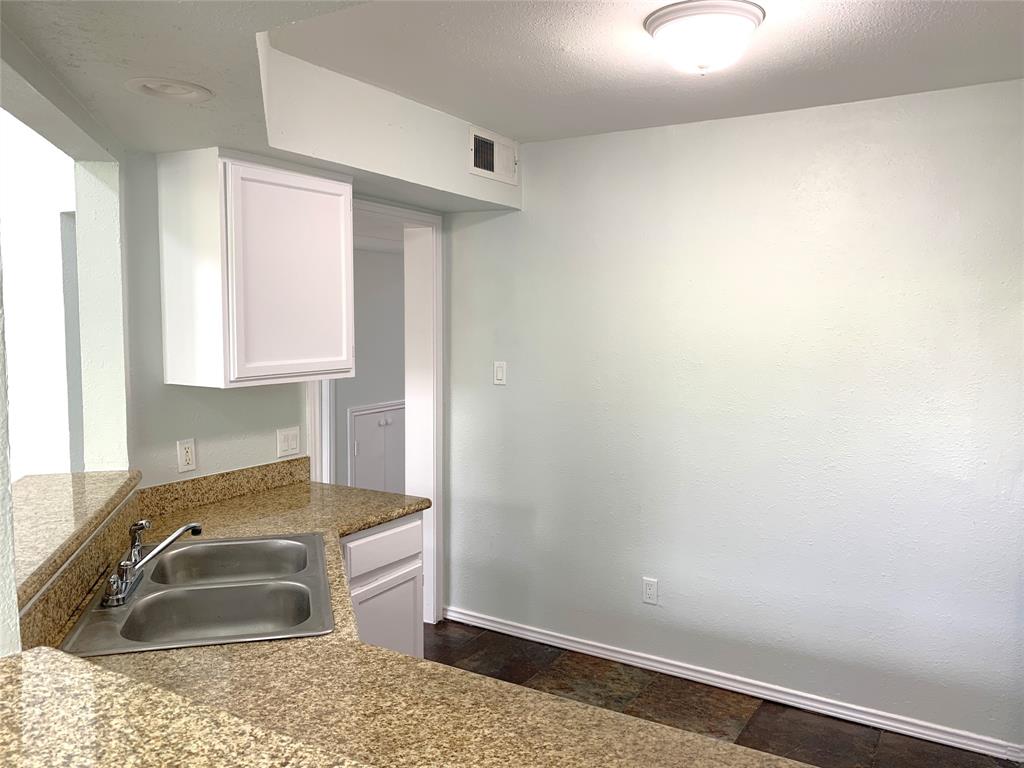 9601 Forest Lane, Unit 1024 Dallas, TX 75243 - Photo 9 of 28 a bathroom with a sink and a mirror