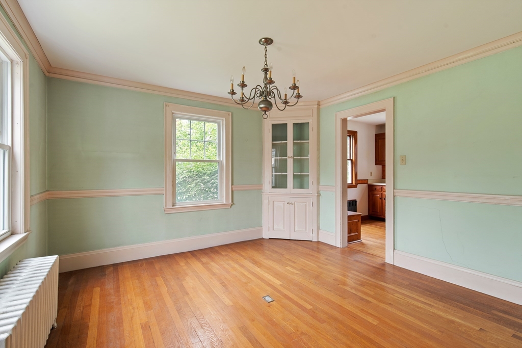 38 Bailey Road Arlington, MA 02476 - Photo 8 of 30 wooden floor in an empty room with a window