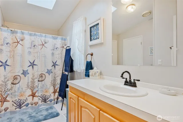 a bathroom with a sink and a mirror