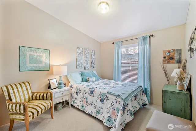 a bedroom with a bed and a couch