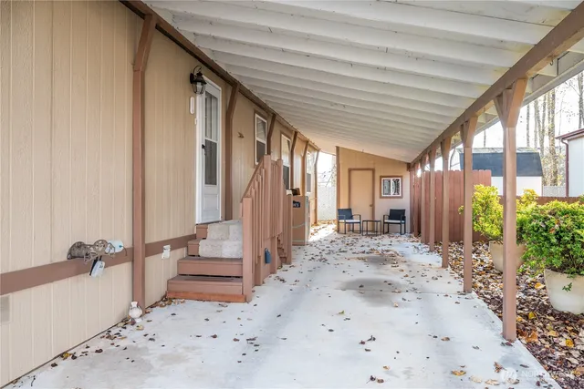 a view of entryway with wooden floor and outdoor space