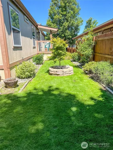 a front view of a house with a yard table and chairs