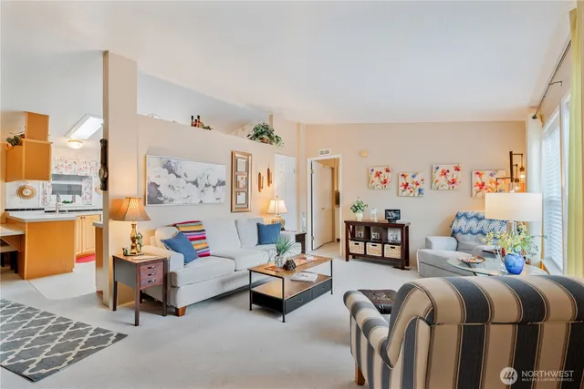 a bedroom with furniture and a large window