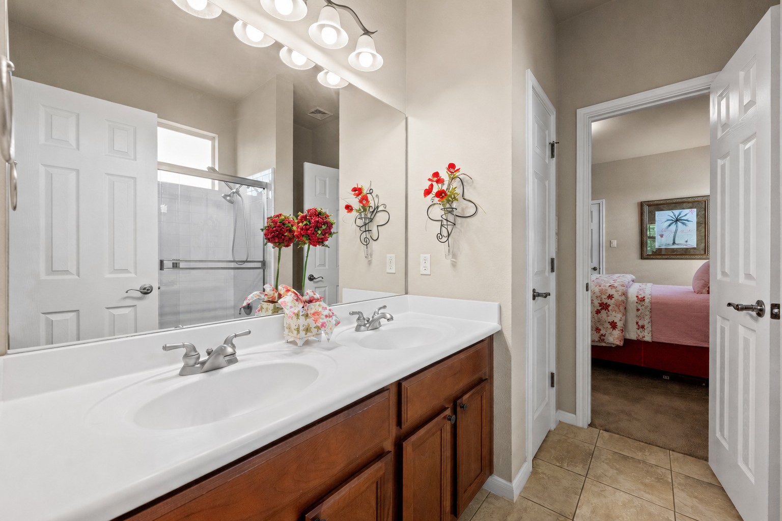 14608 Spillman Ranch Loop Austin, TX 78738 - Photo 27 of 31 a en suite bathroom with a sink double vanity and a mirror