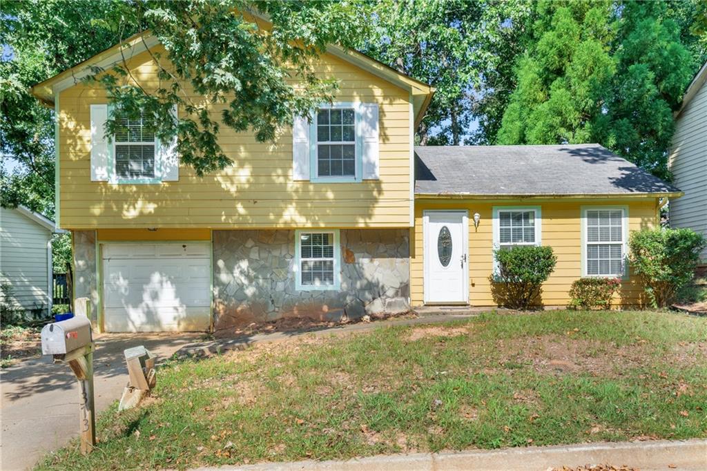 1373 To Lani Farm Road Stone Mountain, GA 30083 - Photo 1 of 1 a view of a house with backyard and sitting area