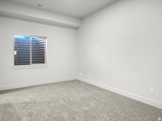 1159 North Broad Hollow Road Garden City, UT 84028 - Photo 52 of 55 Carpeted room featuring a single window with white trim, light gray walls, and white baseboards