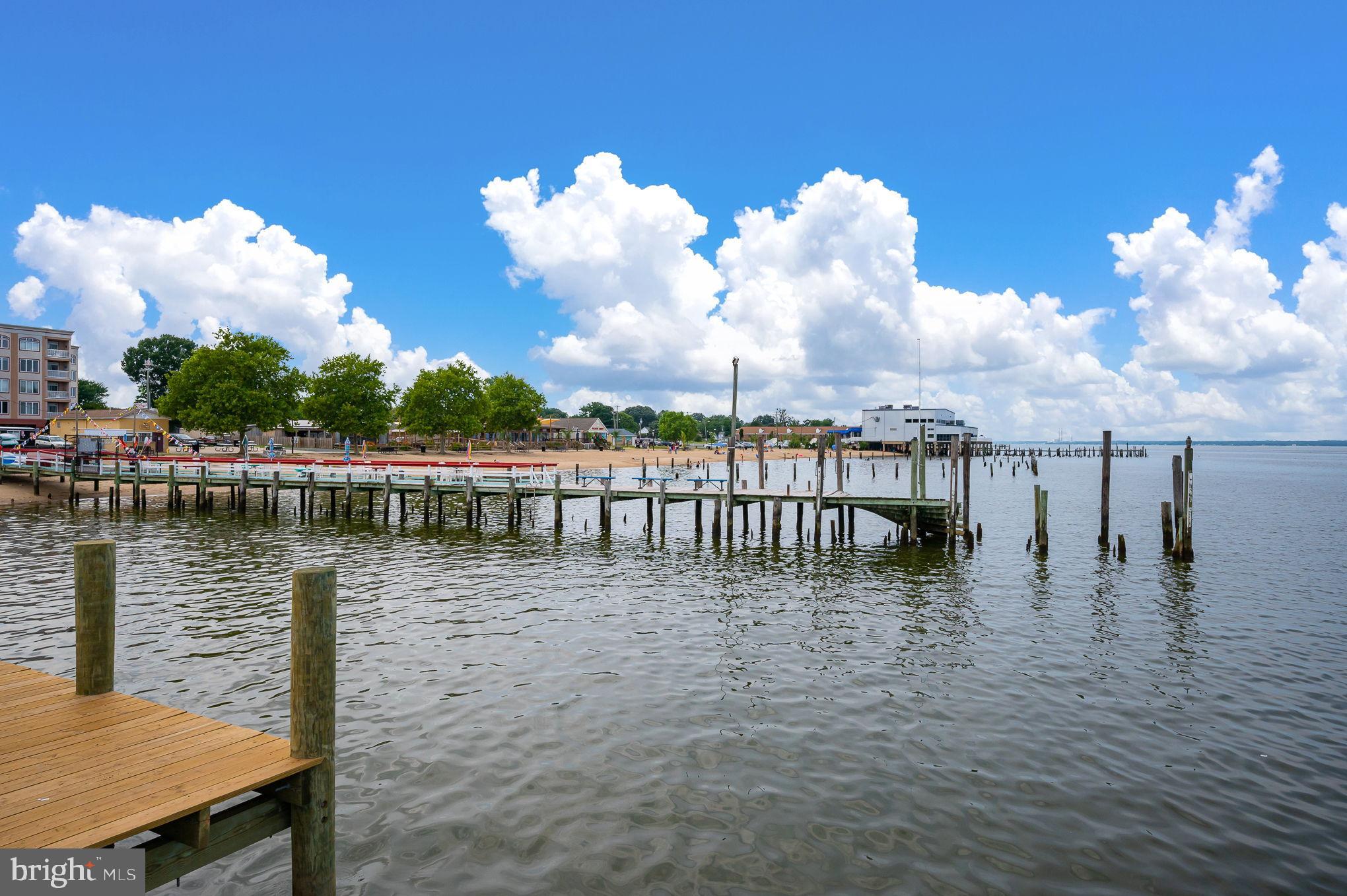 312 9th Street Colonial Beach, VA 22443 - Photo 43 of 62 Serene waterfront with vibrant clouds above.
