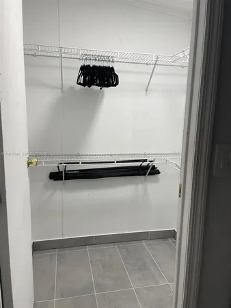 a close view of a faucet a washer and dryer