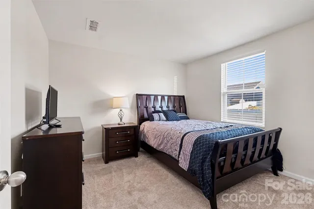 a view of a workspace with a flat screen tv and a window