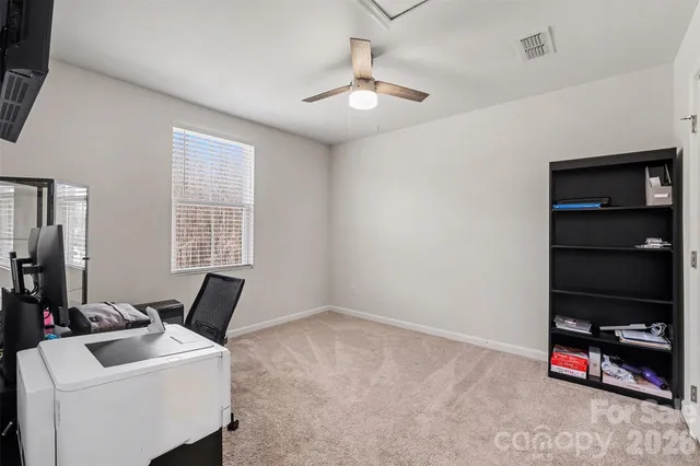 a bathroom with a sink vanity mirror and toilet