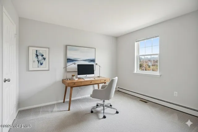 a view of a workspace with furniture