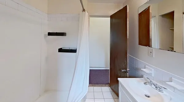 a bathroom with a sink and mirror