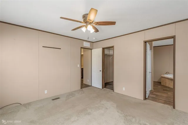 a view of an empty room and bathroom
