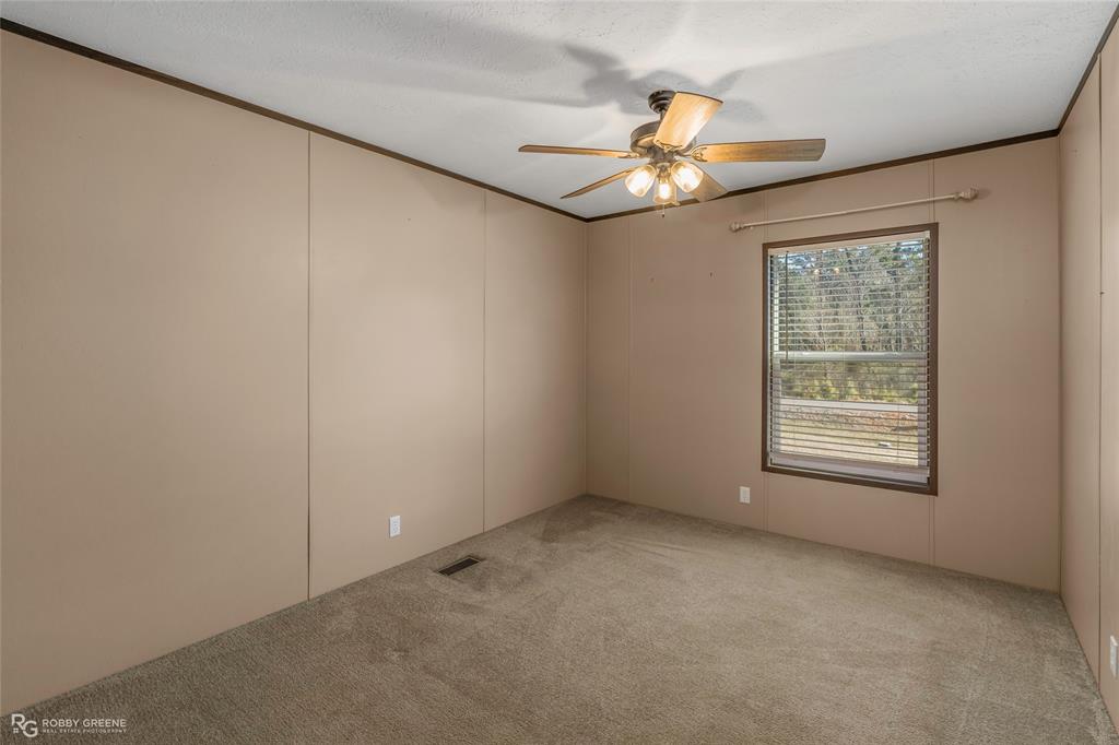 295 Cass Pvt Drive Gloster, LA 71030 - Photo 16 of 28 a view of an empty room with a window