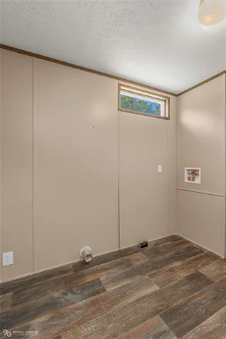 a view of a livingroom with an empty space and window