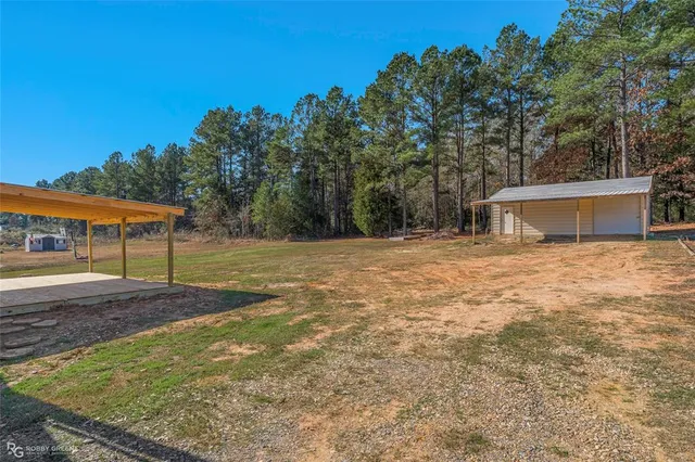 a view of a backyard of the house